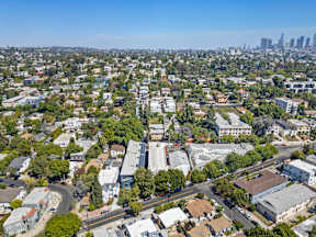 A cityscape with a mix of residential and commercial buildings.
