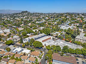 A cityscape with a mix of residential and commercial buildings.