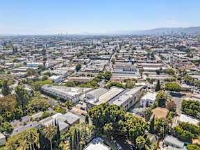 A bird's eye view of a residential area with houses and trees.