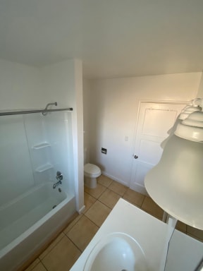 View of lighting in bathroom at Edison Apartments in Burbank, California.