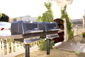 Gas grills in courtyard at Harbor Villa Apartments in San Diego, California.