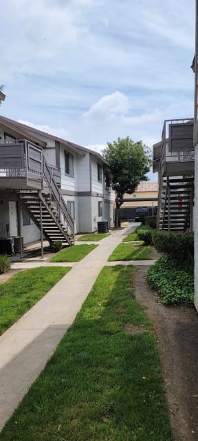 Walkway between buildings at Grand Oaks Apartments in Lake Elsinore, California.
