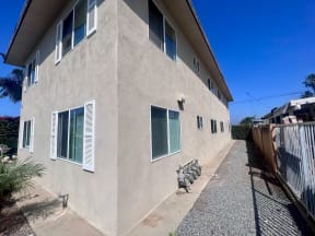 Corner view of apartments at Higgins Street Apartments in Oceanside, California.