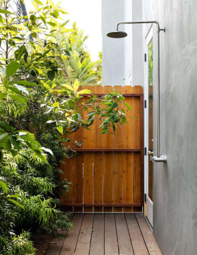 Wooden deck gate and outdoor shower at 633 Palms Blvd. apartments in Venice, California.