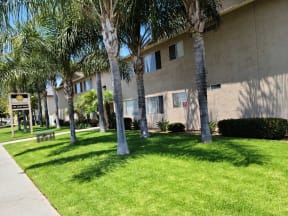 Sidewalk view of Zenith Place Apartments in Chula Vista, California.
