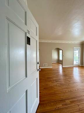 A white door with the number 122 on it.