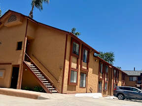 A building with a staircase leading to the second floor.