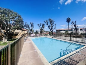 Large fenced swimming pool at Grande Vista Apartments