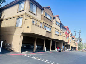 Parking with locked storage under townhome units at Grande Vista Apartments.