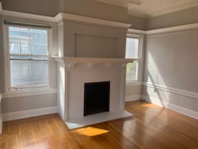 Fireplace and hardwood floors at 900 Taylor Street Apartments.