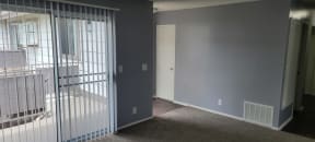 Front enterance living room and hallway to bedrooms and bathroom at Grand Oaks Apartments in Lake Elsinore, California.