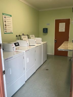 On-site laundry facility at Saint Malo Surf Apartments in Oceanside, California.