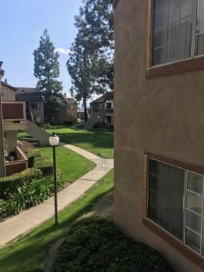 Apartment layout with lots of green space and gardens at Northwood Apartments in Upland, California.