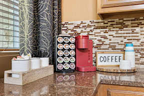 A coffee station with a sign that says coffee.