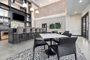 a dining room with a long table and chairs