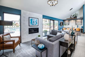 a living room with blue walls and a fireplace