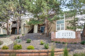 a view point apartments building with a sign and trees
