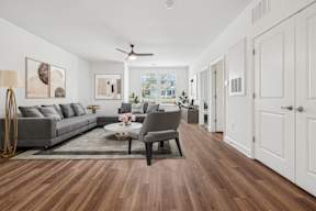 A living room with a grey sofa and a coffee table.