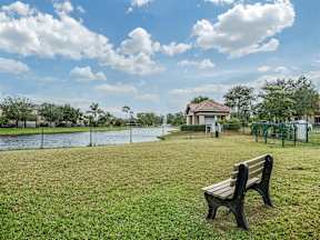 Bench in the grass overlooking a body of water