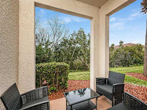 Picture of an outdoor patio with a few tables and chairs