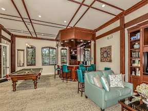 Clubhouse with tables chairs and a pool table