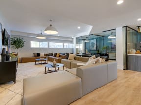 clubroom with couch and office area