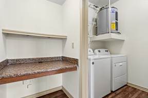 A laundry room with a washer and dryer.