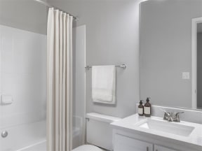 a bathroom with a sink and shower