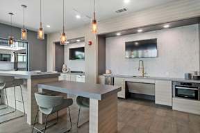 a kitchen with a large island and a dining table