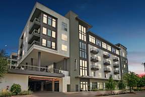 a rendering of a large apartment building with balconies