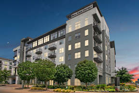a rendering of an apartment building with trees in front of it