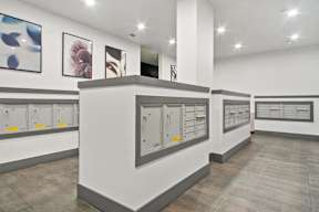 the store has a counter with mailboxes and pictures on the wall