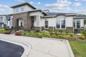 the clubhouse with a sidewalk in front of it