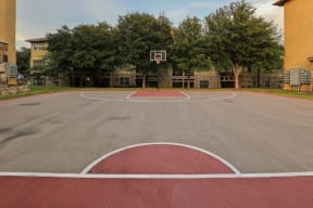 a basketball court in front of a building
