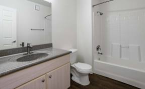 A bathroom with a toilet, sink, and bathtub.at Vintage at Scottsdale, SCOTTSDALE Arizona