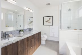a bathroom with a sink and a toilet and a shower