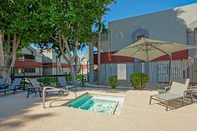 A pool area with a sign that says "Rules" in the background.