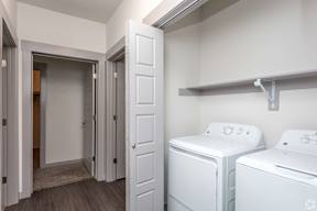 A laundry room with a washer and dryer.