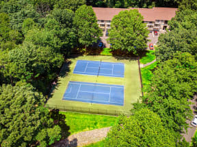 an aerial view of a tennis court at Atlantic Pointe on a green lawn at Atlantic Pointe Apartments, New Jersey