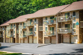 a building with multiple balconies and a parking lot at Atlantic Pointe Apartments, Atlantic Highlands, New Jersey