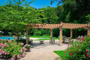 a backyard with a pavilion and a swimming pool at Atlantic Pointe Apartments, Atlantic Highlands
