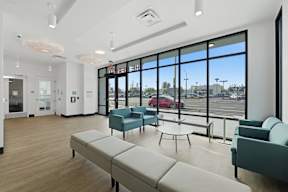 A waiting area with a bench and chairs.