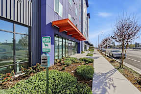 A building with a sign that says "Pet Area" on it.