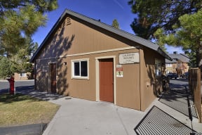 a brown building with a red door and a sign that says lutheran records