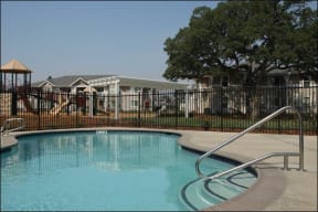 a swimming pool with a fence around it