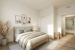 A bedroom with a large bed and a potted plant.