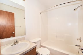 a bathroom with a sink toilet and a shower
