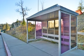 a bus stop on the side of the road