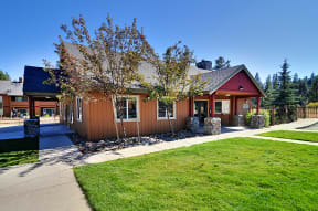 the front of the home with a sidewalk leading to the front door