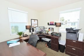 a home office with a desk and a computer